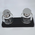 Silver inkwell tops on blown glass ink wells